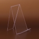 Elegante Buchpräsentation in Schuafenstern, auf den Regalen oder den Theken. Die Stütze ist leicht schief, und das bedeutet optimale Position für die Bücher. Materialstärke: 3mm Farbe: transparent